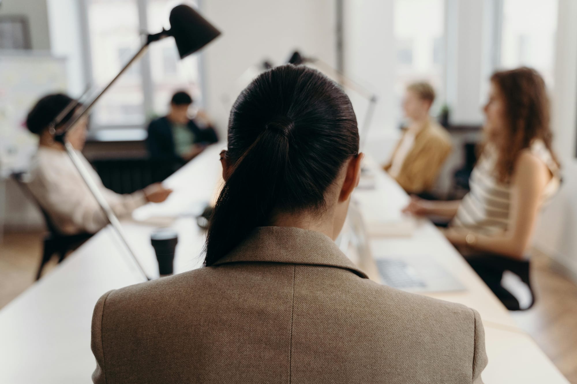Woman looking at a meeting table